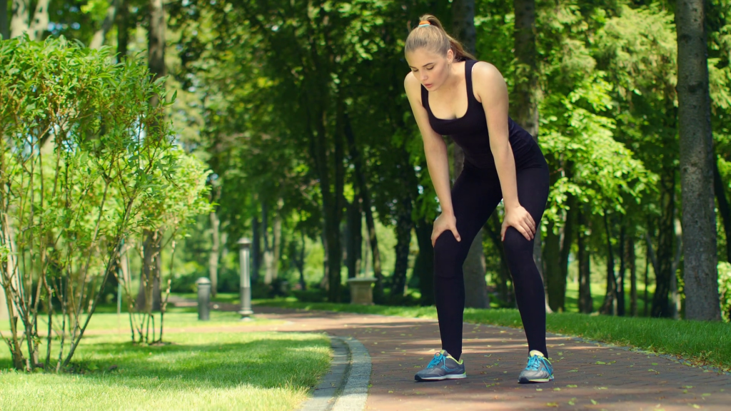 woman breathing after run marathon outdoor tired female runner after running in park fitness woman relaxing after jogging slim girl resting after fitness workout fit girl breathing after training r39hdzw