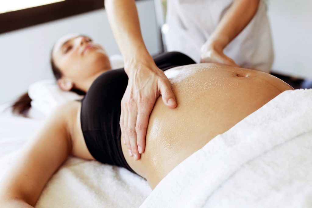 1800x1200 pregnant woman getting massage other